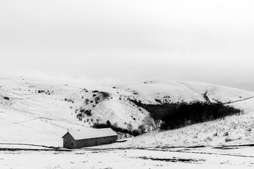 A small mountain retreat covered by snow on Mt. Subasio (Umbria, Italy) during winter season