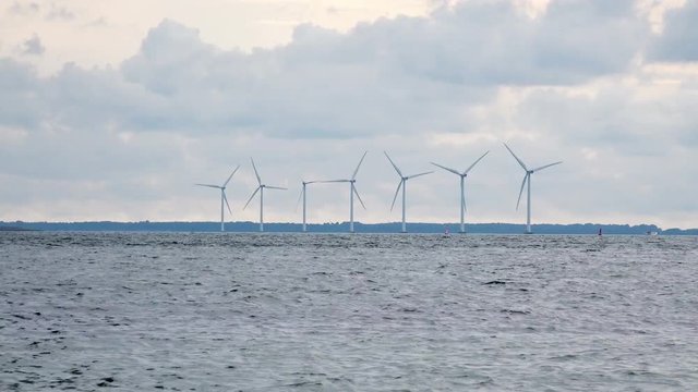 Timelapse of Modern Wind Turbines Farm in the Baltic Sea. 4K Ultra HD 