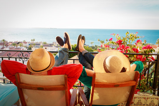 happy couple relax on balcony terrace