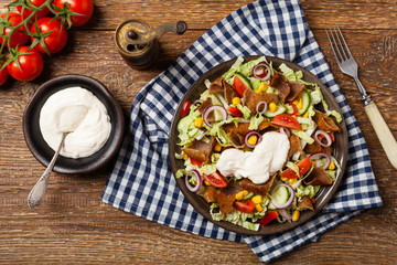 Fototapeta na wymiar Gyros, kebeb. Salad with mutton and vegetables.