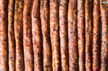 Homemade sausages in a row background