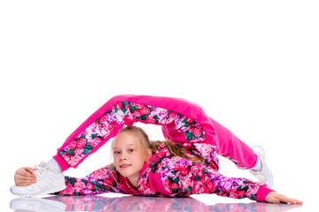 The gymnast perform an acrobatic element on the floor.