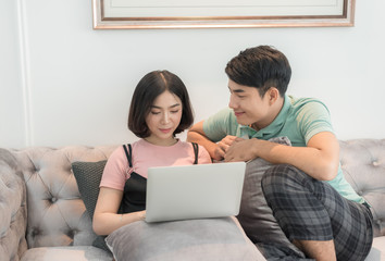 Couple Use Laptop Computer Together In Living Room, Happy Smiling Woman,