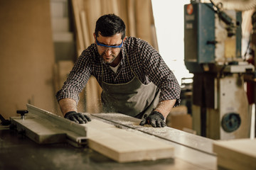 Professional carpenter at work in his laboratory