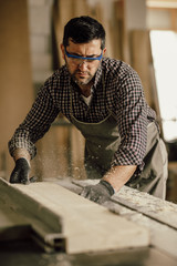 Professional carpenter at work in his laboratory