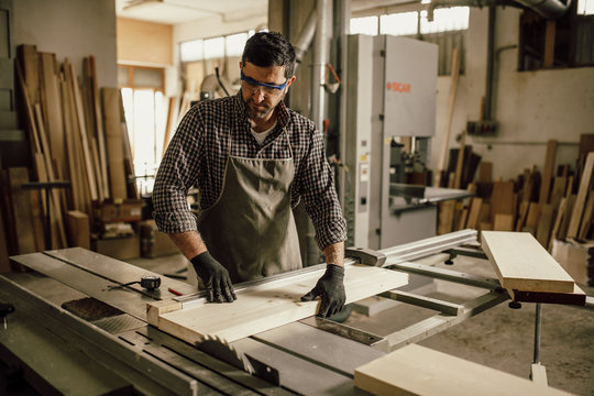 Professional carpenter at work in his laboratory
