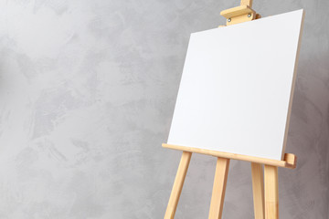 Wooden easel in the room