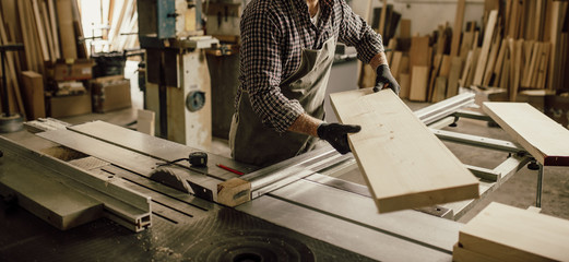 Skilled Carpenter craftsman at work in his workshop