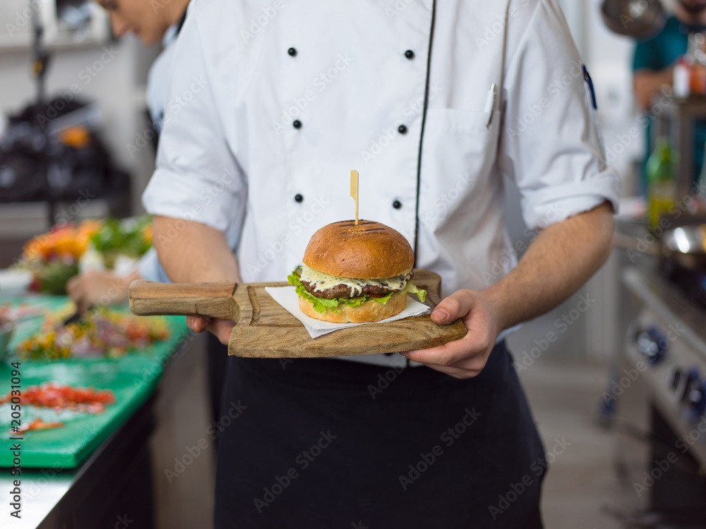 Wall mural chef finishing burger