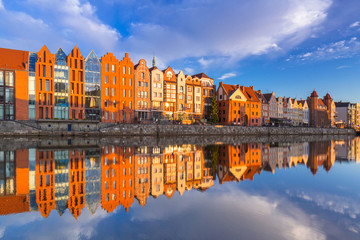 Beautiful old town of Gdansk reflected in Motlawa river at sunrise, Poland.