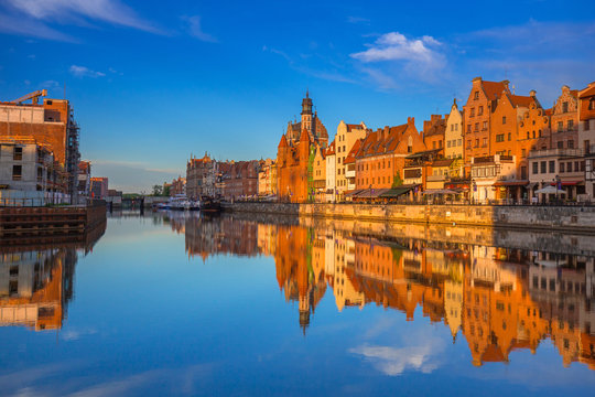 Beautiful old town of Gdansk reflected in Motlawa river at sunrise, Poland.