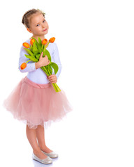 Little girl with a bouquet of tulips.