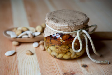 Jam of different types of nuts in syrup or honey