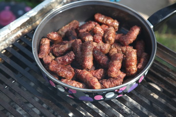 Cevapi (Cevapcici), Bosnian dish prepared on the barbecue and served with Lepinja bread. This dish is popular all over the Balkans, with tourists and locals.