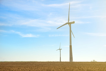 Wind turbines in the field. Eco-energy concept.