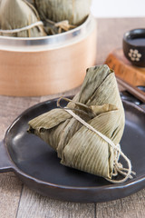 Fototapeta na wymiar Zongzi or rice dumpling on Dragon Boat Festival, Asian traditional food