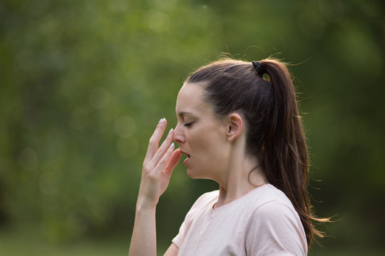 Girl having allergy reaction in park