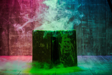 smoke from open vintage book on wooden background