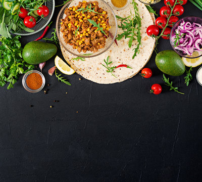 Ingredients For Burritos Wraps With Beef And Vegetables On Black Background. Mexican Food. Top View. Flat Lay