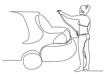 girl washes a car in a swimsuit