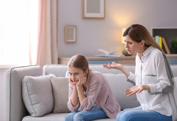 Mother arguing with daughter at home