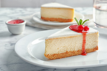 Delicious cheesecake served with sweet jam on plate