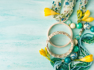 Girl's accessories on turquoise pastel background. Flat lay