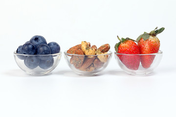 Blueberry Strawberry Herb Spice Almond Cashew Nut in glass bowl on white background