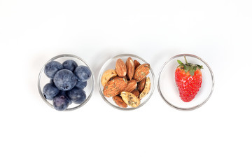 Blueberry Strawberry Herb Spice Almond Cashew Nut in glass bowl on white background