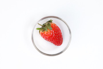 One Red Ripe Strawberry in small glass bowl