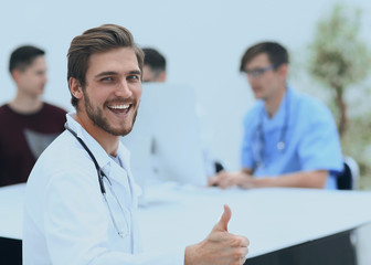 Fototapeta premium smiling doctor showing thumb up