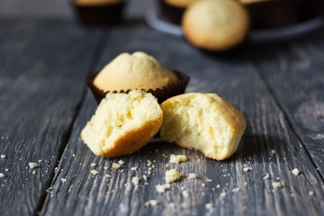 Finished cupcakes in mold, one broken on work surface