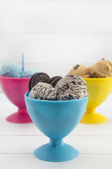 Various Types of Ice Cream Sundaes in Bright Cups