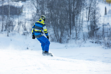 Fototapeta na wymiar Men go skiing on snow in the mountains.
