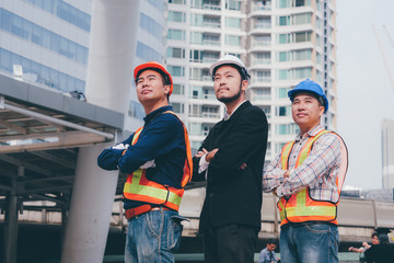 Engineering grop working together at outdoor,happy Teamwork concept.