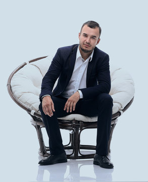 young businessman sitting in a comfortable chair