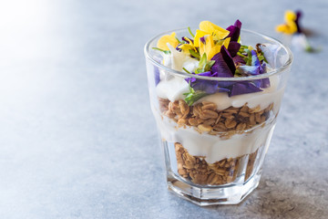 Granola Parfait with Yogurt and Edible Flowers / Muesli.