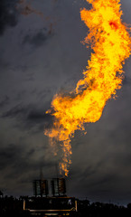Fire from a gas flash on a dark background blur