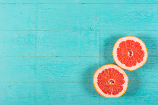 Cut grapefruit on a wooden background