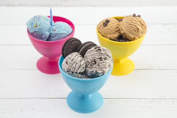 Various Types of Ice Cream Sundaes in Bright Cups