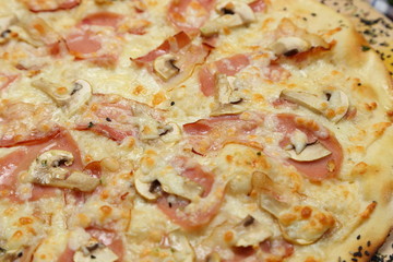Pizza thin with sausage, mushrooms, cheese, spices