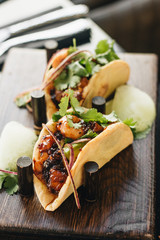 Delicious tacos with vegetables and parsley, Mexican cuisine