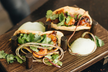 Delicious tacos with vegetables and parsley, Mexican cuisine