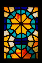 window of a stained-glass window in an old house in Tbilisi