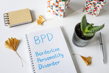BPD Borderline Personality Disorder written in notebook on white table