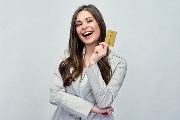 Smiling business woman holding gold credit card.