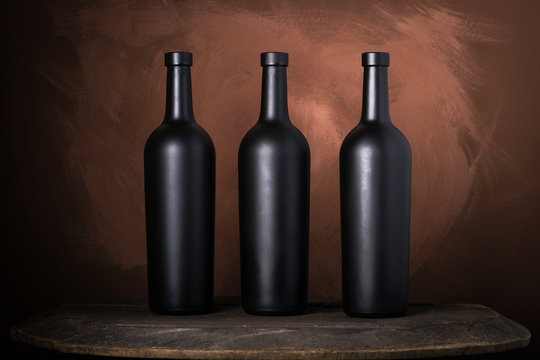 Red wine bottle on a wooden brown background