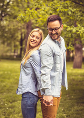 Fototapeta premium Couple standing in park.