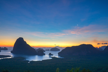 Golden light shine on sea during sunrise. Samet Nangshe Viewpoint, Phang nga, Thailand, the view from the mountain top.