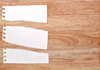 white rip paper is on wooden background